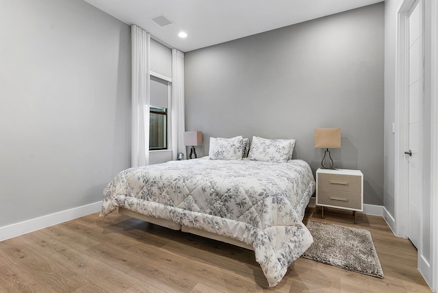 bedroom featuring light hardwood / wood-style flooring