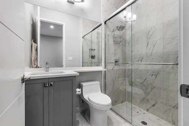 bathroom with toilet, an enclosed shower, and vanity