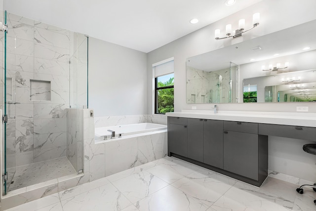 bathroom with vanity and independent shower and bath