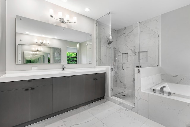 bathroom featuring separate shower and tub and vanity