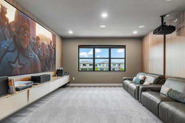 home theater room featuring light carpet