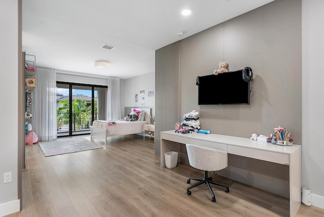 office with light hardwood / wood-style flooring