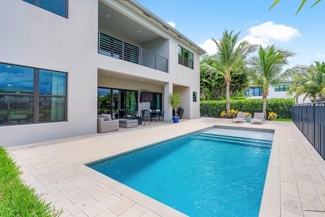 view of swimming pool featuring a patio area and outdoor lounge area