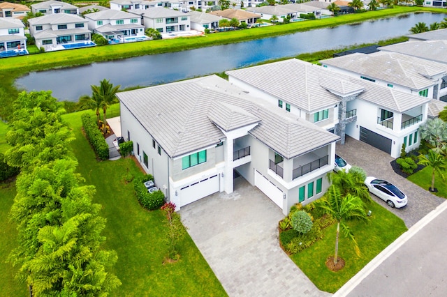 birds eye view of property with a water view