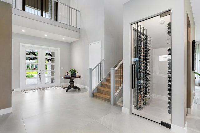 foyer entrance featuring a towering ceiling