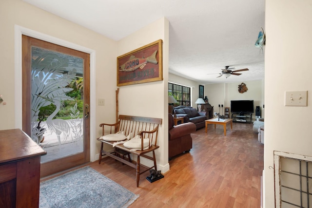 entrance foyer with hardwood / wood-style floors and ceiling fan