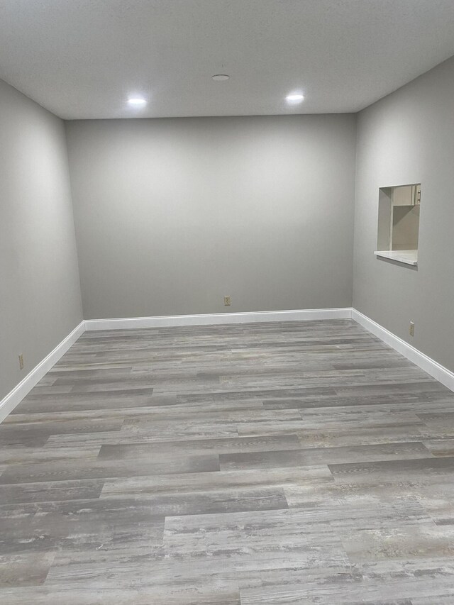 spare room with light wood-type flooring