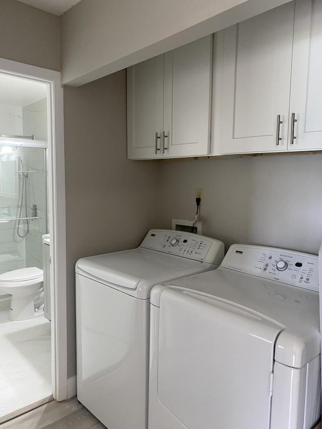 washroom featuring washer and dryer