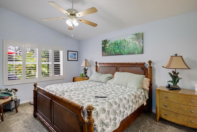 carpeted bedroom featuring lofted ceiling and ceiling fan