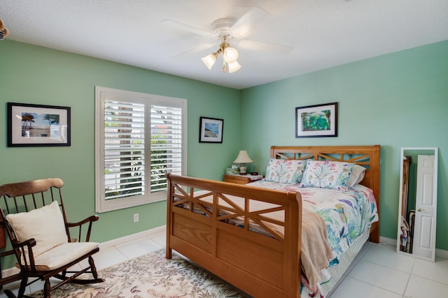 tiled bedroom with ceiling fan