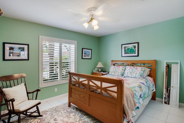 bedroom featuring ceiling fan and light tile patterned flooring