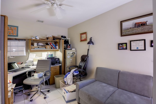 office featuring light tile patterned floors and ceiling fan