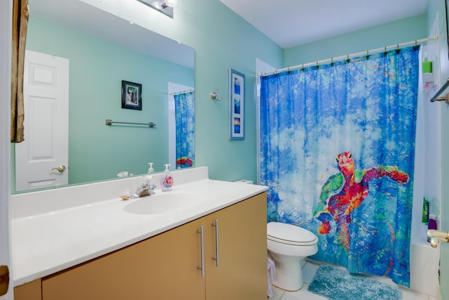 bathroom featuring vanity, tile patterned flooring, and toilet