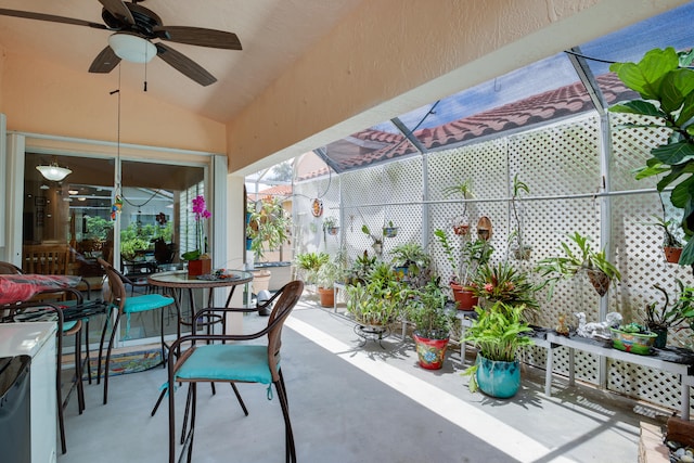 view of patio featuring glass enclosure and ceiling fan