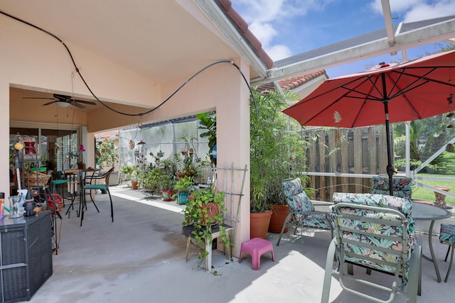 view of patio featuring ceiling fan