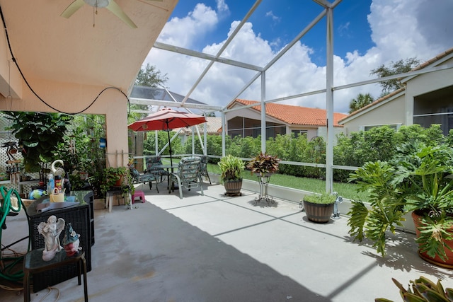 view of patio / terrace featuring a lanai and ceiling fan