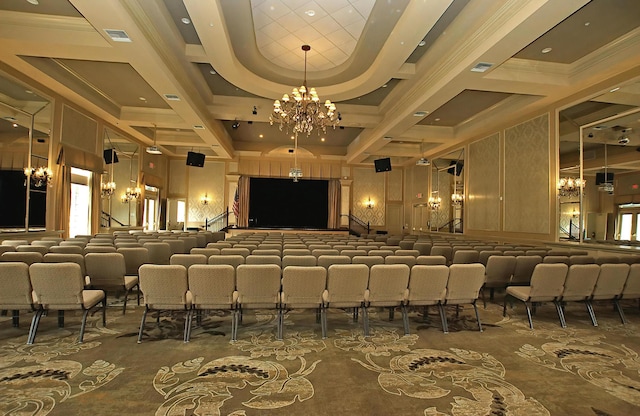 cinema room featuring ornamental molding and a chandelier