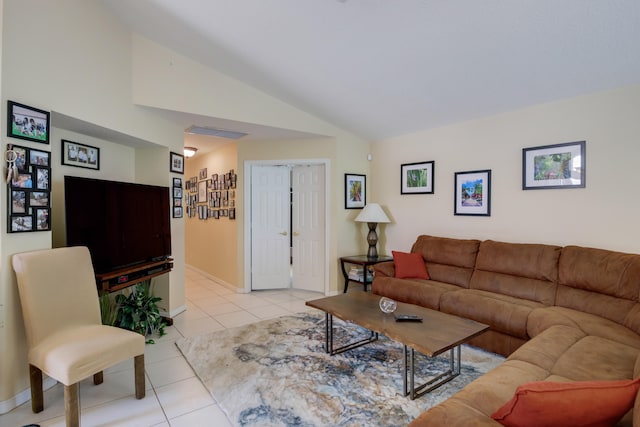 living room with light tile patterned flooring and vaulted ceiling