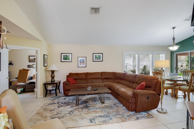 tiled living room with vaulted ceiling