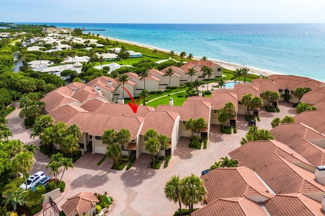 drone / aerial view with a water view and a view of the beach