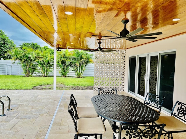 view of patio featuring ceiling fan and french doors