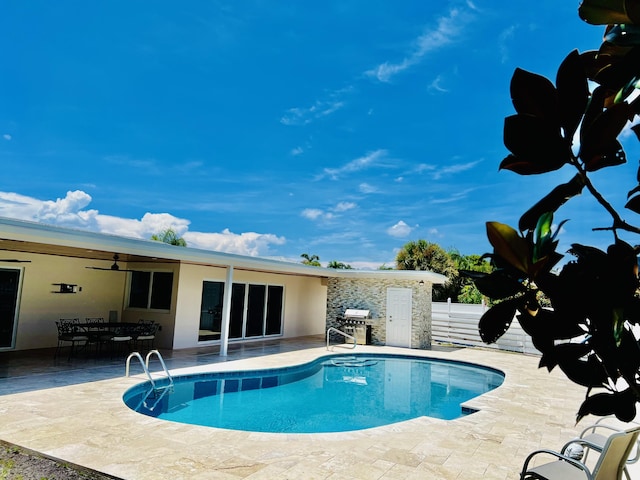 view of swimming pool featuring a patio area, a grill, and ceiling fan