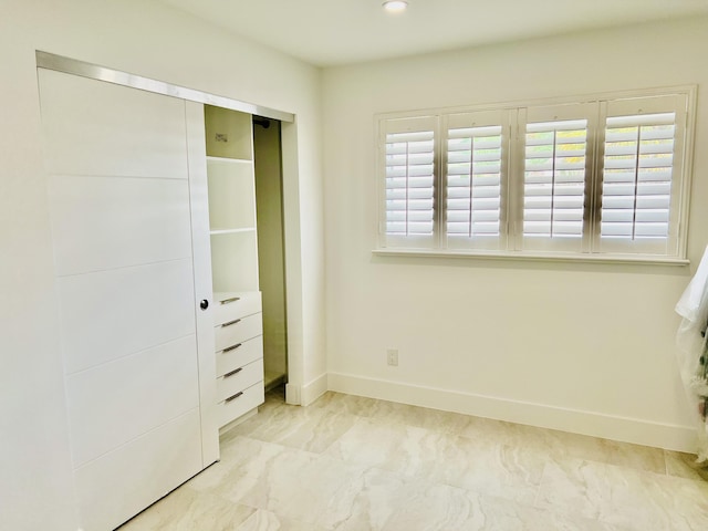 unfurnished bedroom with a closet