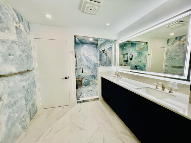 bathroom with vanity, tile walls, and a shower with shower door