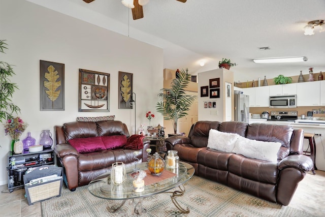 living room featuring ceiling fan and light tile patterned floors