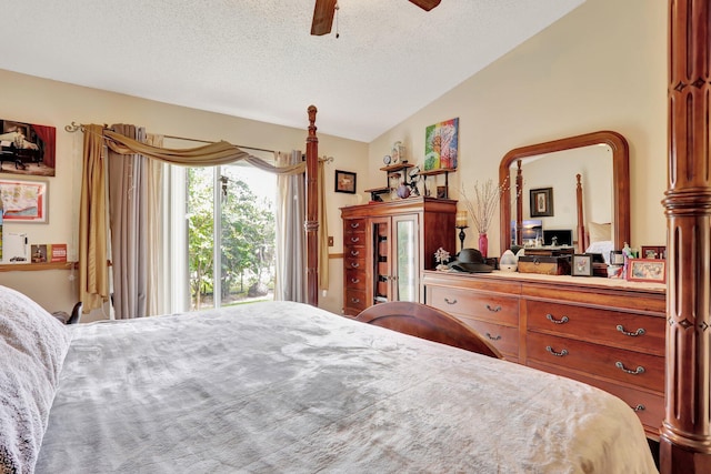 bedroom featuring ceiling fan, a textured ceiling, and lofted ceiling