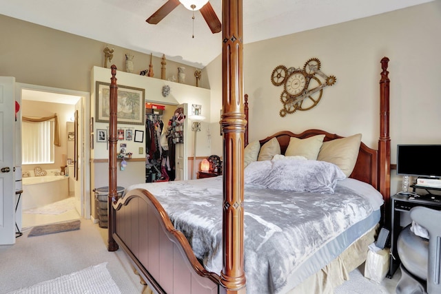 bedroom featuring light carpet, a closet, ceiling fan, and ensuite bathroom