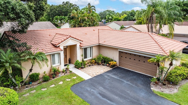 view of front of house featuring a front yard and a garage