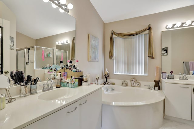 bathroom featuring plus walk in shower, tile patterned floors, and vanity