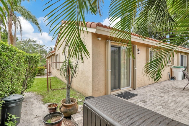 exterior space featuring a yard and a patio area