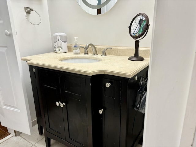 bathroom featuring tile patterned flooring and vanity