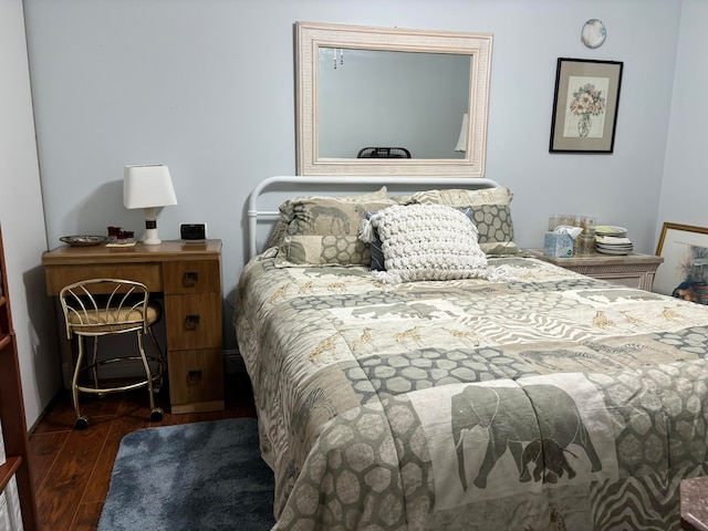 bedroom featuring dark hardwood / wood-style flooring