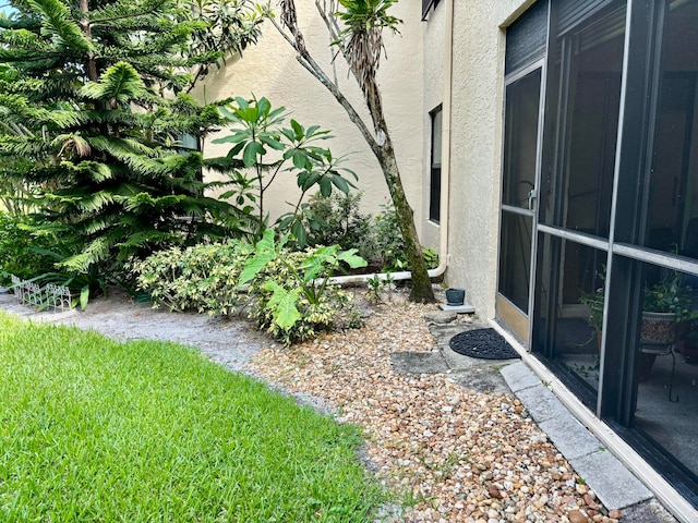 view of yard featuring a sunroom