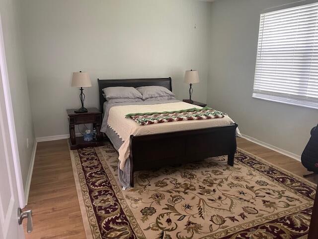 bedroom with hardwood / wood-style flooring