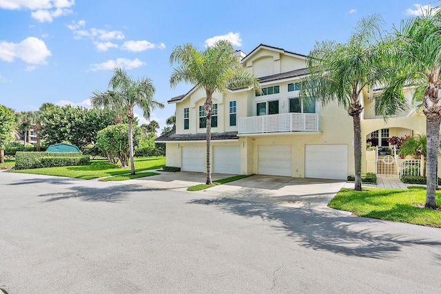 view of front of home featuring a garage and a front lawn