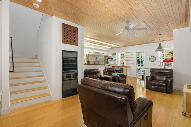 living room with wooden ceiling, light hardwood / wood-style floors, and ceiling fan