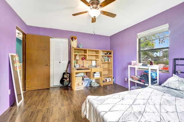 bedroom featuring ceiling fan, a closet, and dark hardwood / wood-style flooring