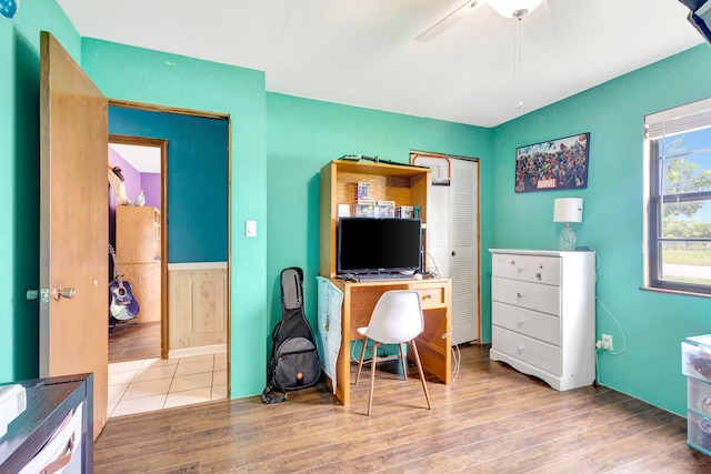 home office featuring ceiling fan and hardwood / wood-style flooring