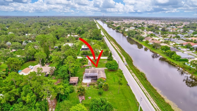 birds eye view of property featuring a water view