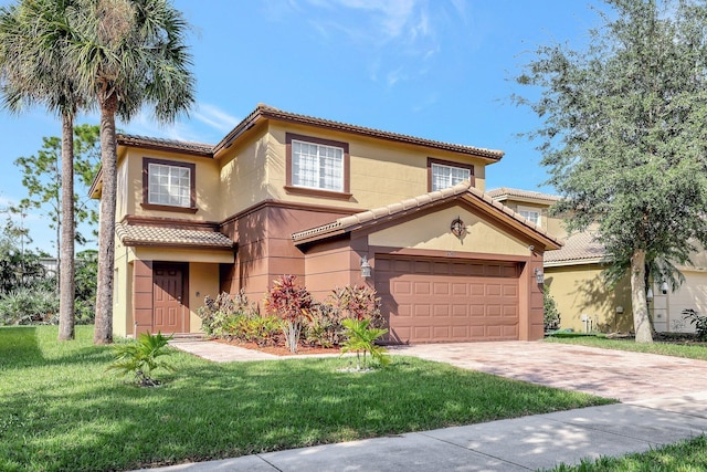 mediterranean / spanish home featuring a garage and a front lawn