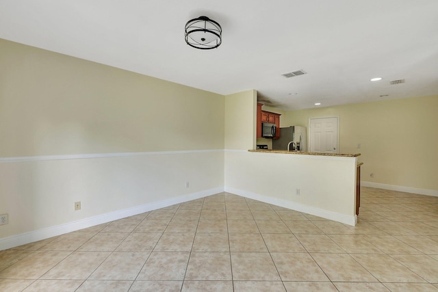 interior space featuring light tile patterned floors