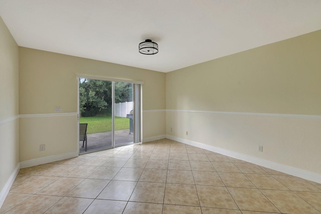 spare room featuring light tile patterned flooring