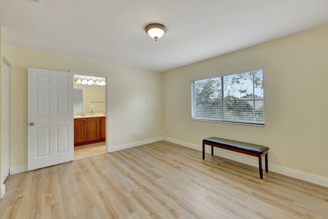 spare room featuring light wood-type flooring