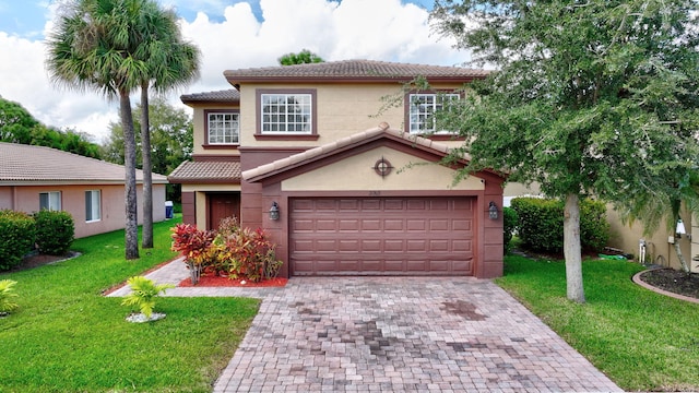 mediterranean / spanish-style home with a front yard and a garage