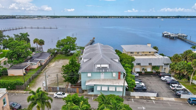 birds eye view of property with a water view