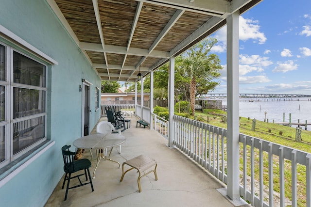 view of patio with a water view